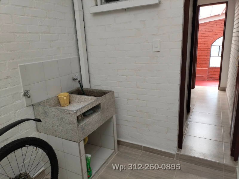 Lavadero granito y tanque de agua